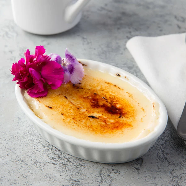 Acopa 5 Oz. Oval Bright White Fluted Porcelain Souffle / Creme Brulee Dish - 12/Pack
