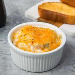 Acopa 10 Oz. Round Bright White Fluted Porcelain Souffle / Creme Brulee Dish - 12/Pack